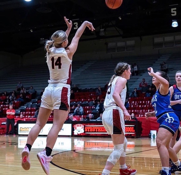 Chloe Neider puts up a shot for the Ladycats.