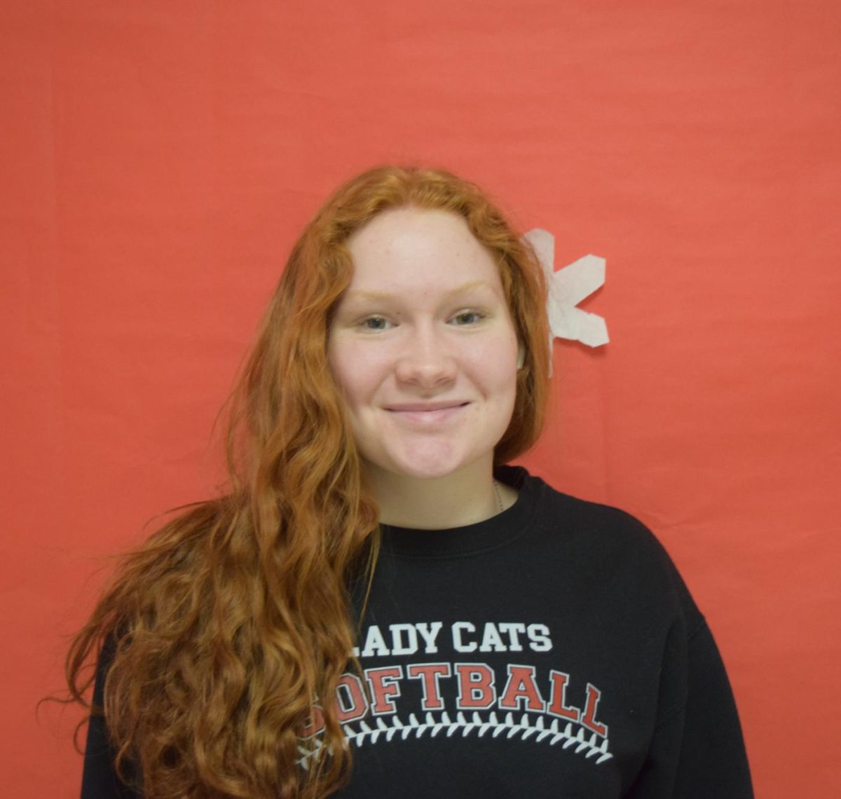 Natalie Adams, sophomore, is happy with the Ladycats performance against East.