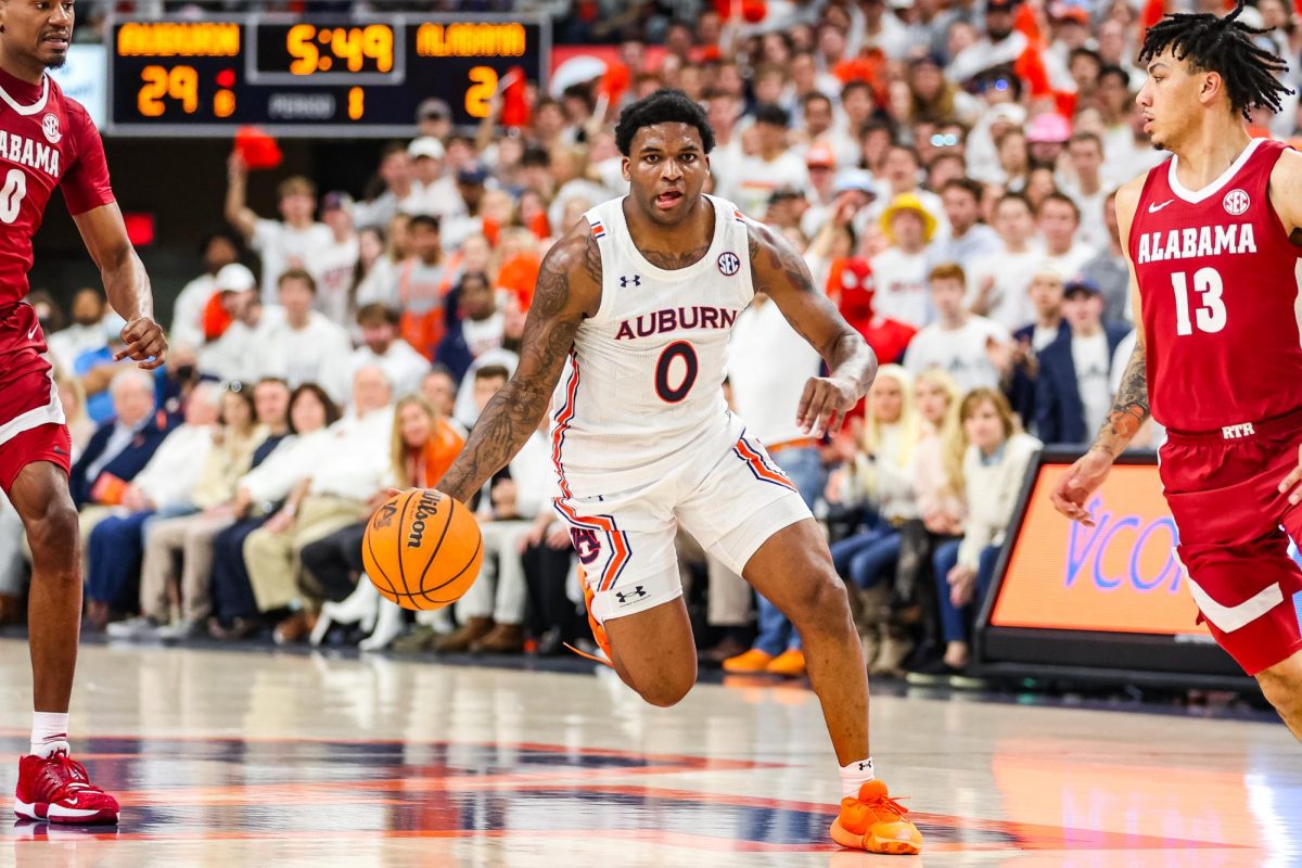 No. 1 Auburn outlasts No. 2 Alabama 94-85 in top-2 SEC battle.