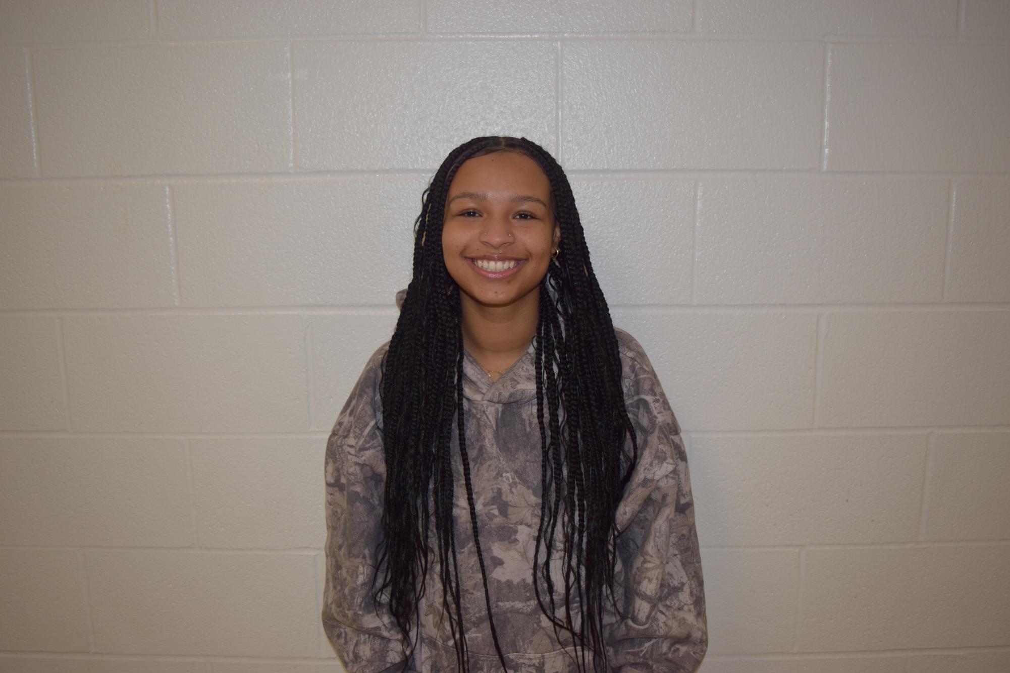 Kylee Kashmiry, junior, is a junior varsity cheerleader for the Cats.