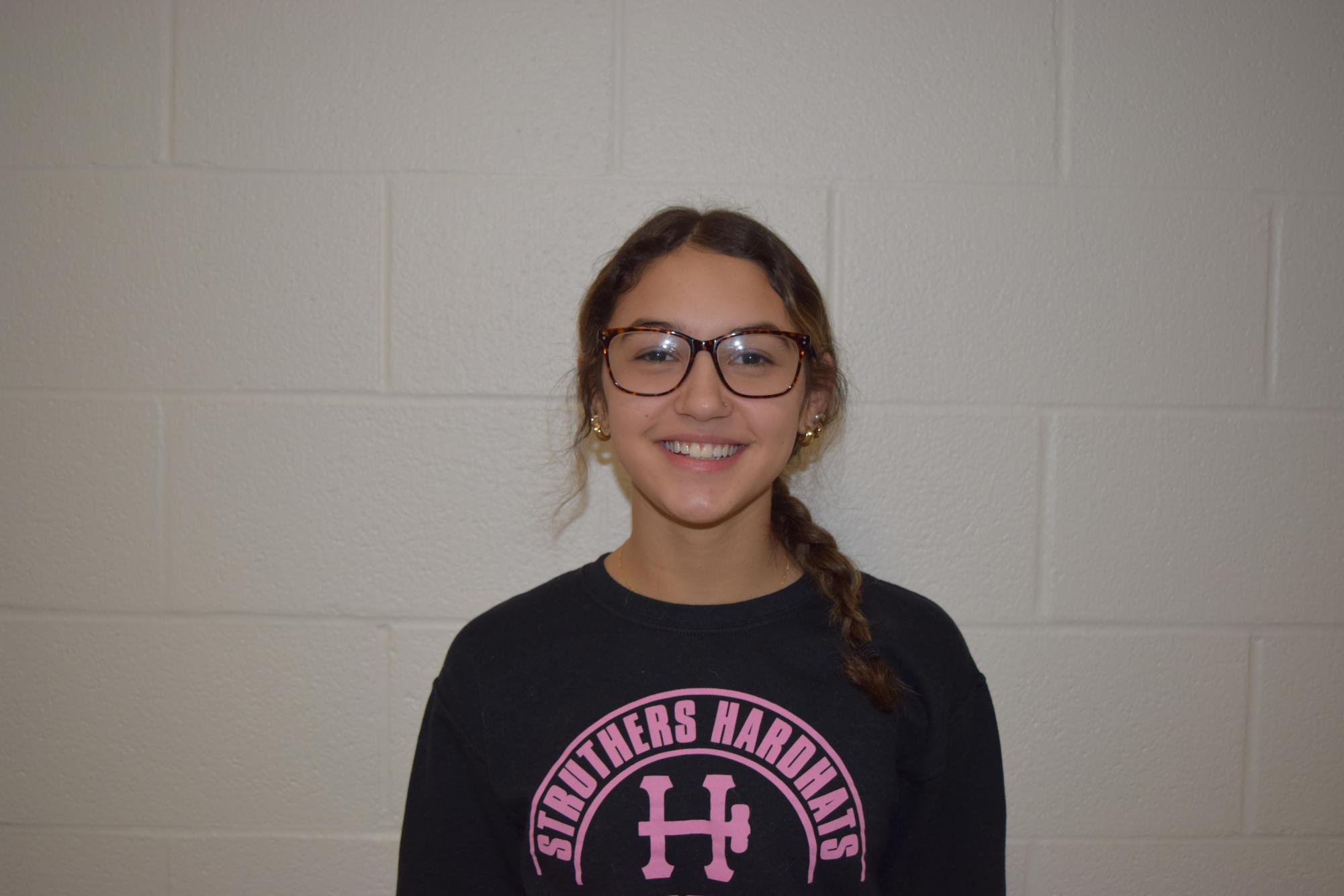 Myra Aponte, freshman, is a cheerleader for the Wildcats.