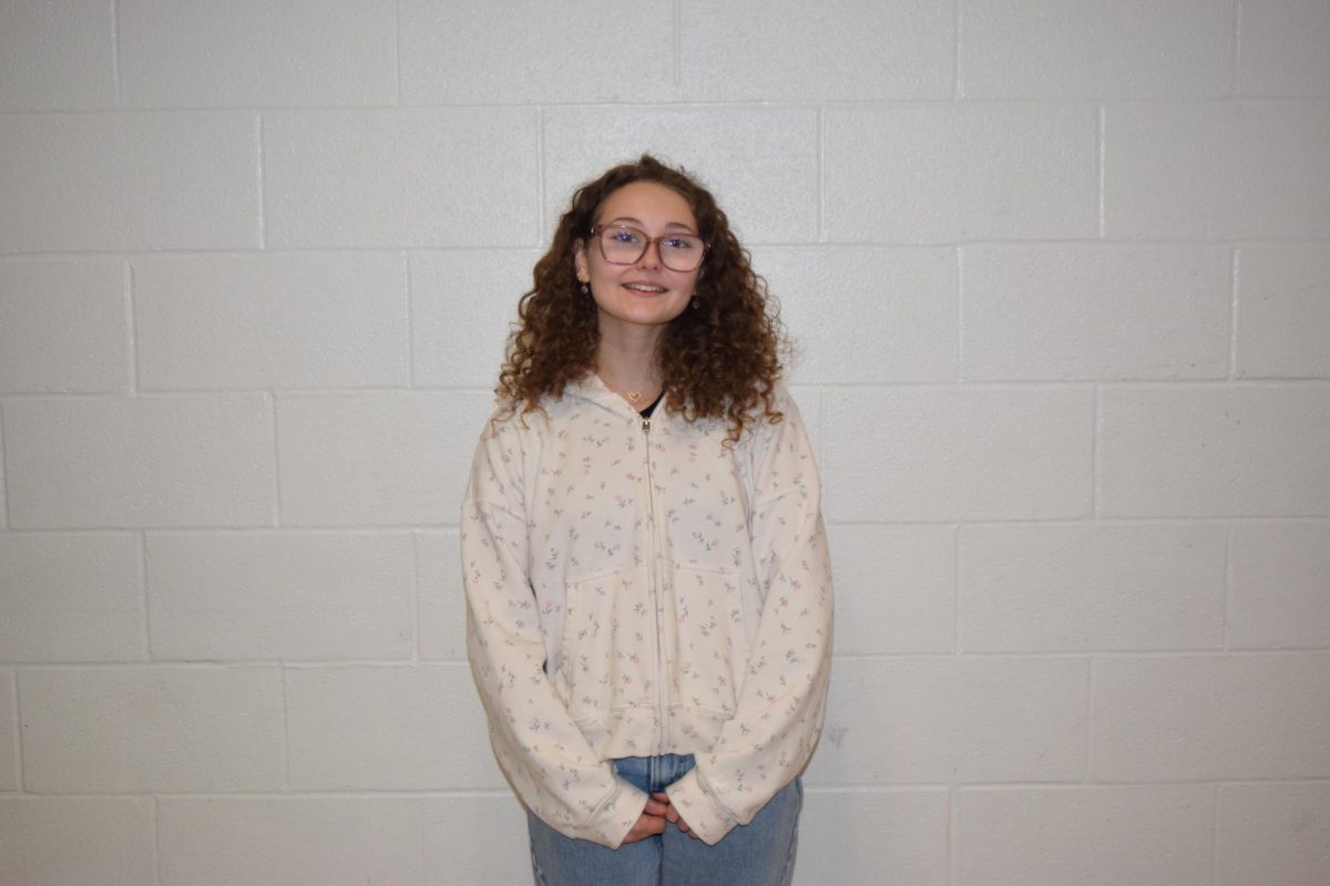 Genevieve Purcell, sophomore, cheers for the Cats.