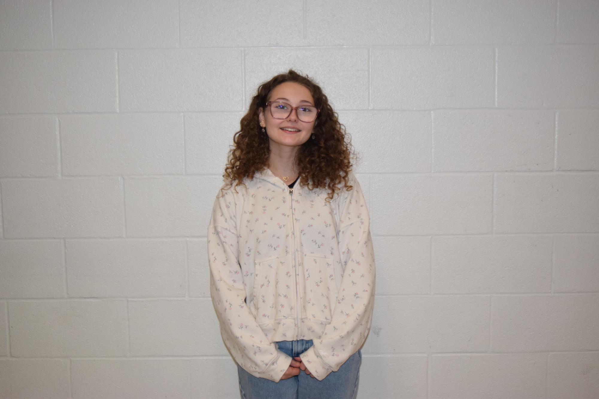 Genevieve Purcell, sophomore, cheers for the Cats.