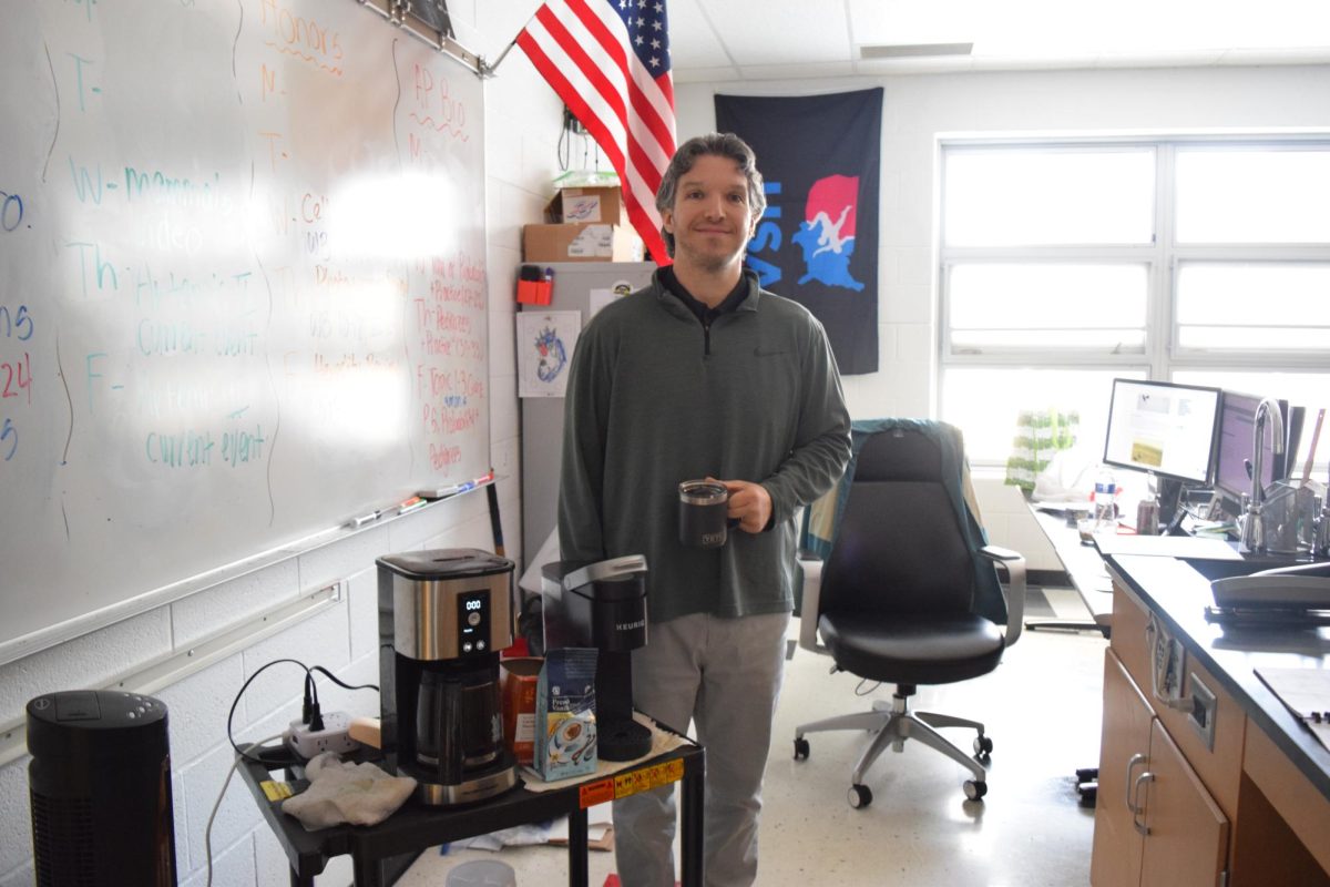 Mr. Drass, science teacher, is an avid coffee drinker.
