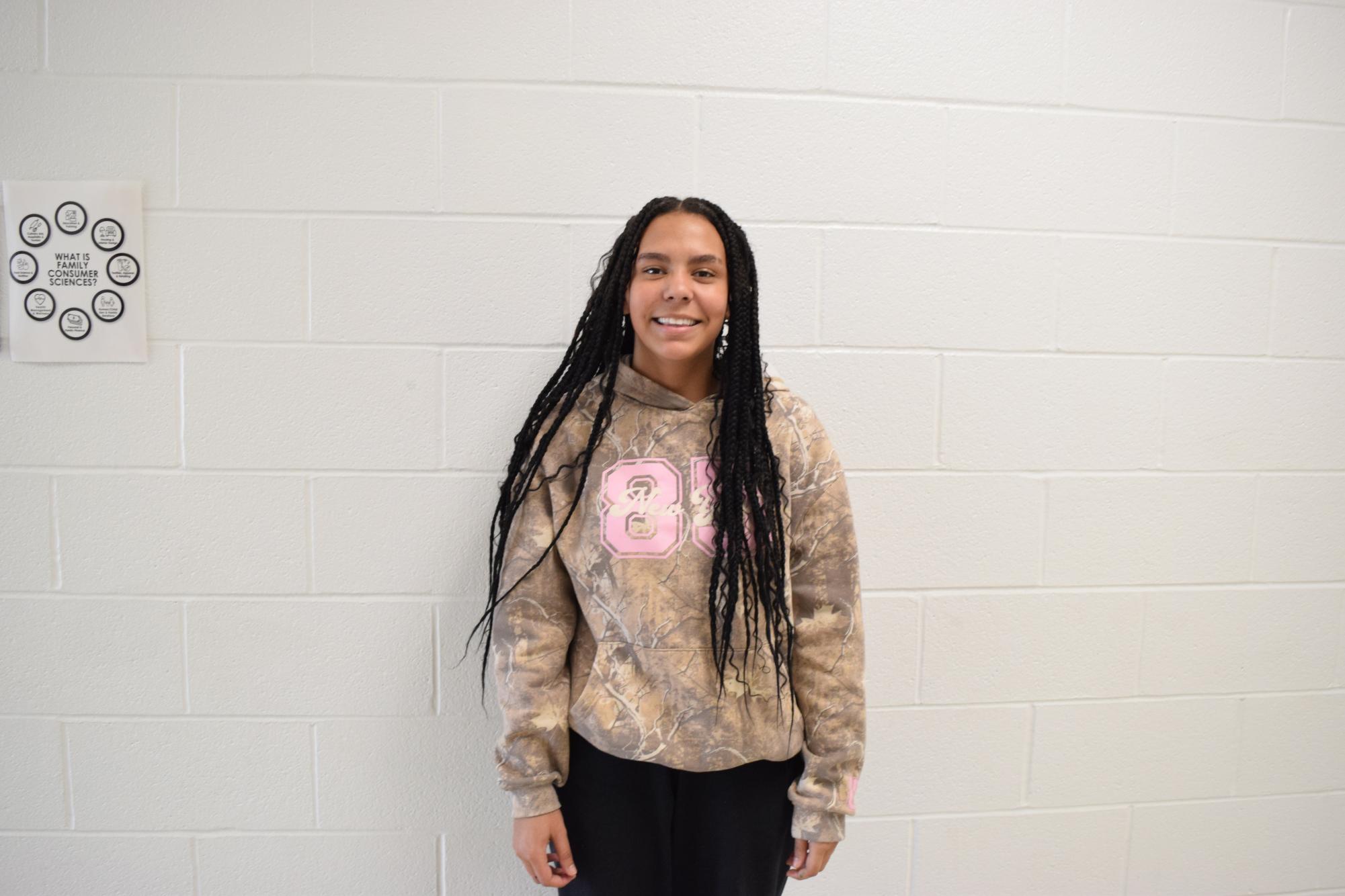 Leah Hall, freshman, is a member of the cheer squad.